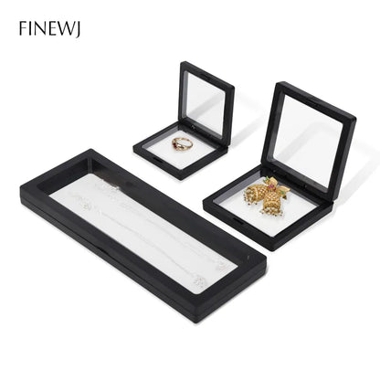 Reusable display frames for jewelry, gemstones, figures and coins in a floating look available in various sizes from 5cm side length to 23cm side length in white and black